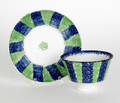 Blue and green rainbow spatter bullseye cup and saucer 19th c