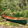 Arthur E Levenseller 20foot Canoe with Two Canoe Paddles