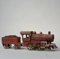 Redpainted Tin Toy Locomotive and Tender