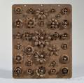Rosettedecorated Iron Plate