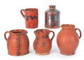 Three Pennsylvania redware pitchers 19th c