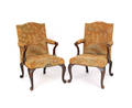 Pair of George II style open armchairs