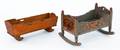 Two painted doll cradles
