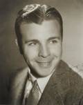 DICK POWELL PHOTOGRAPH SIGNED TO HAROLD LLOYD