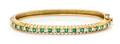 An 18 Karat Yellow Gold Emerald and Diamond Bangle Bracelet J Cooper