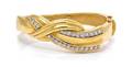 An 18 Karat Yellow Gold and Diamond Bangle Bracelet