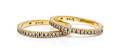 A Pair of 18 Karat Yellow Gold and Diamond Bands
