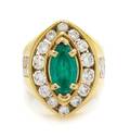 An 18 Karat Yellow Gold Emerald and Diamond Ring