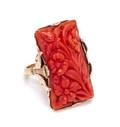 An 18 Karat Bicolor Gold and Carved Coral Ring