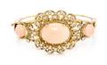 A Yellow Gold Coral and Diamond Bangle Bracelet