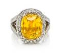 A Platinum Gold Yellow Sapphire and Diamond Ring