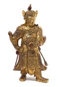 A Gilt and Red Lacquered Wood Figure of Immortal