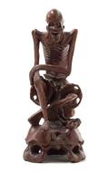 A Carved Rosewood Figure of an Immortal
