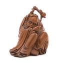 A Carved Rosewood Figure of a Seated Monk