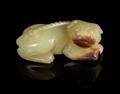 A Yellow Jade Figure of a Recumbent Dog