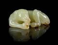 A Yellow Jade Figure of a Recumbent Dog