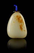 A Celadon and Russet Jade Snuff Bottle
