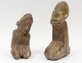 TWO PRIMITIVE STONE CARVINGS OF KNEELING FIGURES