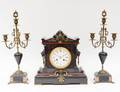 BLACK SLATE AND BRASS THREE PIECE CLOCK GARNITURE