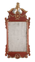 Mahogany and parcel gilt looking glass