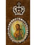 A RUSSIAN ANTIQUE MEDALLION ICON OF SAINT JOHN THE BAPTIST WITH GLASS GEMS