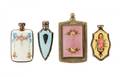 Four Diminutive Guilloche Enameled Perfume Viles
