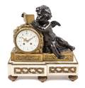 A Louis XVI Style Gilt and Patinated Bronze and Marble Mantel Clock