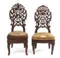 A Pair of Black Forest Pierce Carved Side Chairs