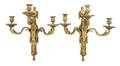 A Pair of Neoclassical Gilt Bronze ThreeLight Sconces