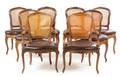 A Set of Eight Louis XV Style Walnut Dining Chairs