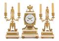 A French Gilt Bronze and Marble ThreePiece Clock Garniture