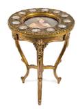 A Louis XV Style Porcelain and Gilt Bronze Mounted Giltwood Gueridon