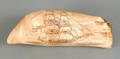 Scrimshaw decorated whale tooth