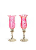 Pair of weighted sterling candelabra with cranberry etched glass shades
