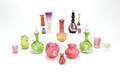 Sixteen pieces of enameled colored glass tableware to include decanters