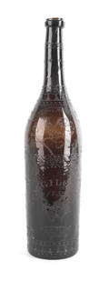 Etched amber glass wine bottle dated