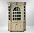 Carved Painted and Glazed Barrelback Pine Corner Cupboard