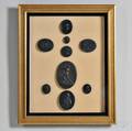 Nine Wedgwood and Related Black Basalt Framed Medallions
