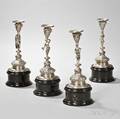 Four Continental Silver Figural Candlesticks