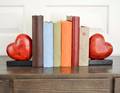 Pair of Carved Stone Heartform Bookends with Four Photo Albums and a Bird Box