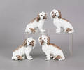 Set of four French porcelain dogs with underglaze crossed swords marked with an  S