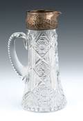 Cut glass pitcher with sterling silver mount by Dominick  Haff
