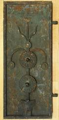 Cast iron door with applied tulip ornament