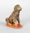 Pennsylvania redware figure of a seated dog mid 19th c