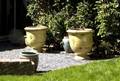 ZAPPA PAIR OF MONUMENTAL FRENCH GLAZED TERRA COTTA PLANTERS