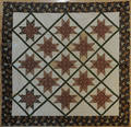 Pieced star in diamond quilt ca 1840