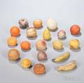 Nineteen Carved and Painted Stone Fruit