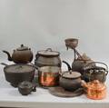 Ten Cast Iron and Copper Pots and Kettles