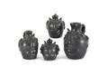 Four Jim Seagreaves pottery face jugs