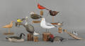 Eight carved and painted birds by Peter Peltz